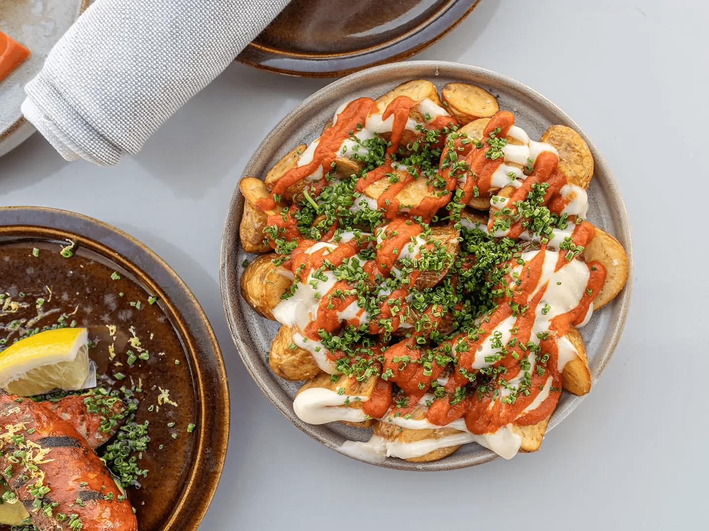 Patatas bravas with romesco and aioli at Mar | Muntanya